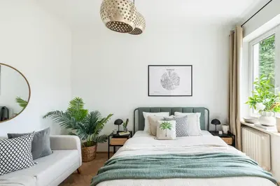 Łóżko lub łóżka w pokoju w obiekcie Aleja Wyzwolenia 9 by Homeprime