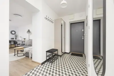 Kuchnia lub aneks kuchenny w obiekcie Elegant Grey Apartment Wspólna Śródmieście in Warsaw by Noclegi Renters