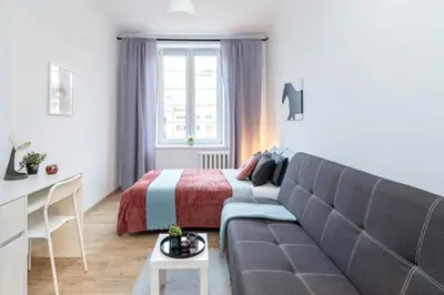 Łóżko lub łóżka w pokoju w obiekcie Zajęcza Apartment near Copernicus Center by Mia
