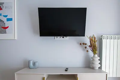 Telewizja i/lub zestaw kina domowego w obiekcie Apartament Koszykowa 3
