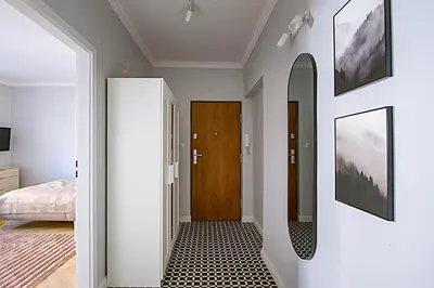 Łóżko lub łóżka w pokoju w obiekcie Apartament Koszykowa 3