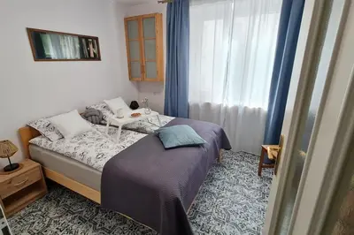 Łóżko lub łóżka w pokoju w obiekcie Apartament Zachodni z balkonem 4 osoby