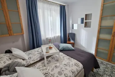 Łóżko lub łóżka w pokoju w obiekcie Apartament Zachodni z balkonem 4 osoby