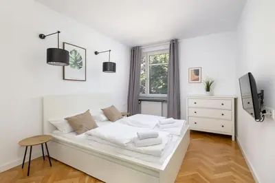 Łóżko lub łóżka w pokoju w obiekcie Apartment near Elektrownia Powiśle