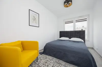 Łóżko lub łóżka w pokoju w obiekcie Apartament z Widokiem na Centrum 9 Piętro & Parking by Noclegi Renters