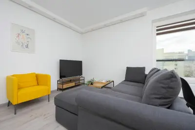 Część wypoczynkowa w obiekcie Apartament z Widokiem na Centrum 9 Piętro & Parking by Noclegi Renters