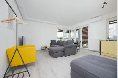 Część wypoczynkowa w obiekcie Apartament z Widokiem na Centrum 9 Piętro & Parking by Noclegi Renters