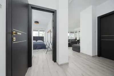 Łóżko lub łóżka w pokoju w obiekcie Apartament z Widokiem na Centrum 9 Piętro & Parking by Noclegi Renters
