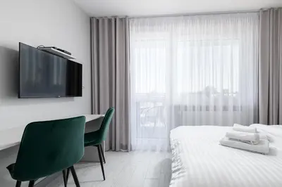 Łóżko lub łóżka w pokoju w obiekcie RentPlanet - Apartamenty Pileckiego