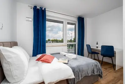 Łóżko lub łóżka w pokoju w obiekcie RentPlanet - Apartamenty Pileckiego