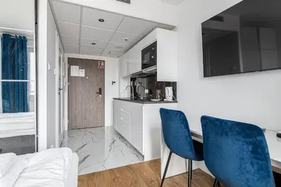 Kuchnia lub aneks kuchenny w obiekcie RentPlanet - Apartamenty Pileckiego