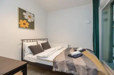 Łóżko lub łóżka w pokoju w obiekcie Lineburg Villa Apartments