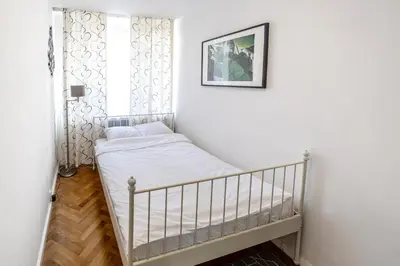 Łóżko lub łóżka w pokoju w obiekcie Corazziego Plac Bankowy Apartment