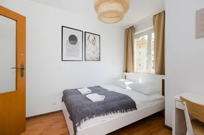 Łóżko lub łóżka w pokoju w obiekcie ShortStayPoland Tomcia Palucha B118