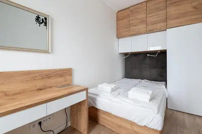 Łóżko lub łóżka w pokoju w obiekcie RentPlanet - Bliska Wola