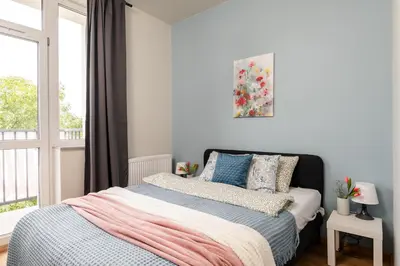 Łóżko lub łóżka w pokoju w obiekcie SuperApart Zdobnicza 4 - Komfortowy apartament