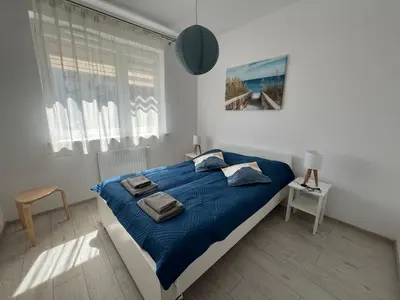 Łóżko lub łóżka w pokoju w obiekcie Apartment Nova Ochota - BLUE