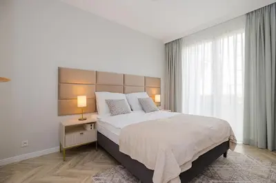 Łóżko lub łóżka w pokoju w obiekcie Holzera Prestige Apartment