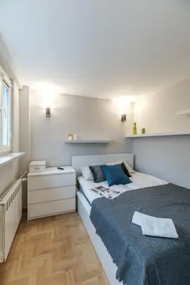 Łóżko lub łóżka w pokoju w obiekcie Warsaw Inside Solec III