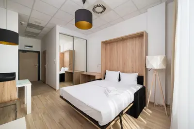 Łóżko lub łóżka w pokoju w obiekcie Varsovia Jerozolimskie Studio 232 by BookingHost