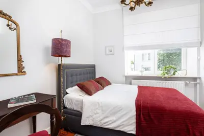 Łóżko lub łóżka w pokoju w obiekcie Ruby Apartment Powisle