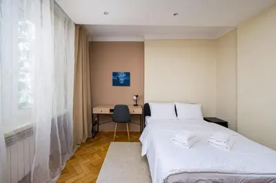 Łóżko lub łóżka w pokoju w obiekcie Ogrodowa Pleasant Apartment by BookingHost