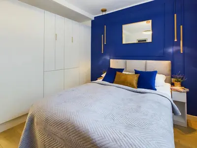 Łóżko lub łóżka w pokoju w obiekcie Unique Studio for 2 people Wilanowska in Warsaw by Noclegi Renters