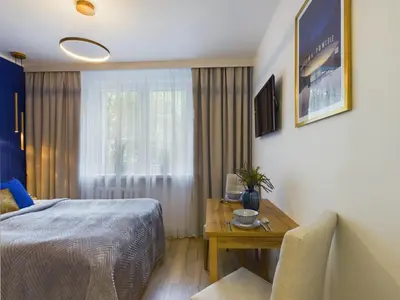 Łóżko lub łóżka w pokoju w obiekcie Unique Studio for 2 people Wilanowska in Warsaw by Noclegi Renters