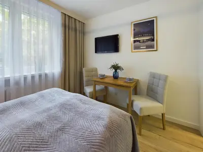 Łóżko lub łóżka w pokoju w obiekcie Unique Studio for 2 people Wilanowska in Warsaw by Noclegi Renters
