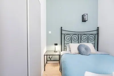 Łóżko lub łóżka w pokoju w obiekcie Gigi Studio Deluxe Mokotow