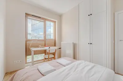 Łóżko lub łóżka w pokoju w obiekcie Apartament Zdziechowskiego