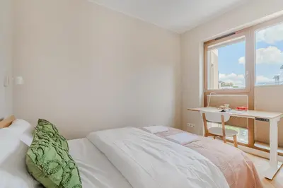 Łóżko lub łóżka w pokoju w obiekcie Apartament Zdziechowskiego