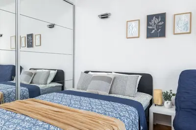 Łóżko lub łóżka w pokoju w obiekcie SuperApart Tarchomińska apt 20 - Studio z Wi-Fi