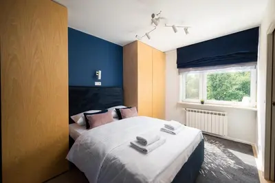 Łóżko lub łóżka w pokoju w obiekcie Elektrownia Powiśle Stylish Apartment by BookingHost