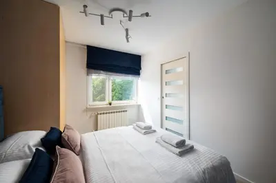Łóżko lub łóżka w pokoju w obiekcie Elektrownia Powiśle Stylish Apartment by BookingHost