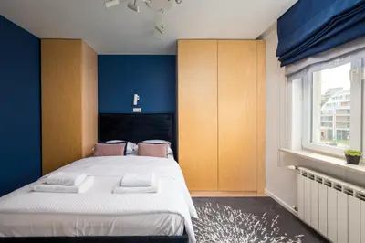 Łóżko lub łóżka w pokoju w obiekcie Elektrownia Powiśle Stylish Apartment by BookingHost