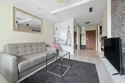 Telewizja i/lub zestaw kina domowego w obiekcie RentPlanet - Apartament Mokotowska