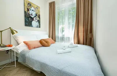 Łóżko lub łóżka w pokoju w obiekcie Koszykowa 3 - Better Rental