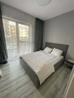 Łóżko lub łóżka w pokoju w obiekcie AirPort Apartment Cybernetyki 3c