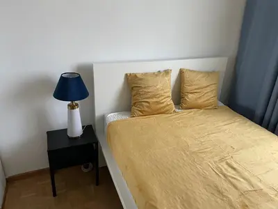 Łóżko lub łóżka w pokoju w obiekcie Ursynow Warsaw View Apartment
