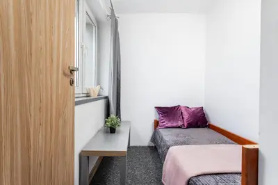 Łóżko lub łóżka w pokoju w obiekcie SuperApart Świętokrzyska 35 - Blisko PKiN i Metra