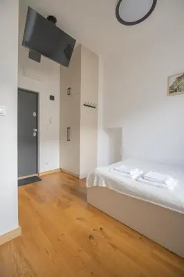 Łóżko lub łóżka w pokoju w obiekcie Micro Chmielna