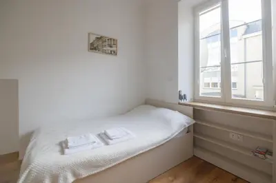 Łóżko lub łóżka w pokoju w obiekcie Micro Chmielna
