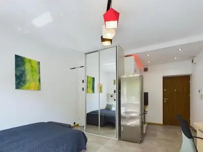 Łóżko lub łóżka w pokoju w obiekcie Beautiful Studio Perfect for Remote Work by Noclegi Renters