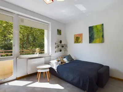 Łóżko lub łóżka w pokoju w obiekcie Beautiful Studio Perfect for Remote Work by Noclegi Renters