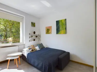 Łóżko lub łóżka w pokoju w obiekcie Beautiful Studio Perfect for Remote Work by Noclegi Renters
