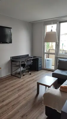 Telewizja i/lub zestaw kina domowego w obiekcie Lenki Apartamenty Metro Bródno