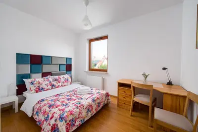 Łóżko lub łóżka w pokoju w obiekcie Strzelców 2-Bedroom Apartment by BookingHost