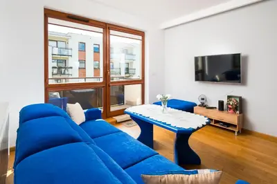 Telewizja i/lub zestaw kina domowego w obiekcie Strzelców 2-Bedroom Apartment by BookingHost
