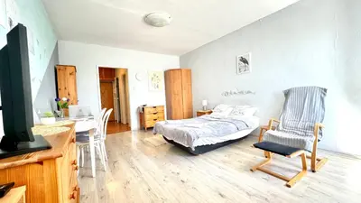 Łóżko lub łóżka w pokoju w obiekcie Sady Żoliborskie